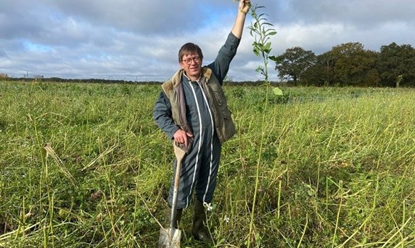 A farmer standing in a field.